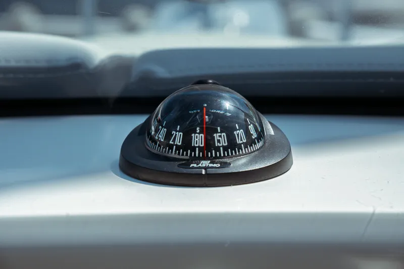 Slide: The Image of Compass on Jeanneau NC Weekender 795 Series 2, 2023 model, dashboard view. - 54