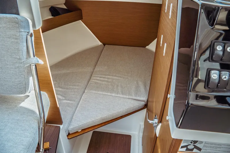 Slide: The Image of 2023 Jeanneau NC Weekender 795 Series 2 cabin interior with cushioned seating. - 56
