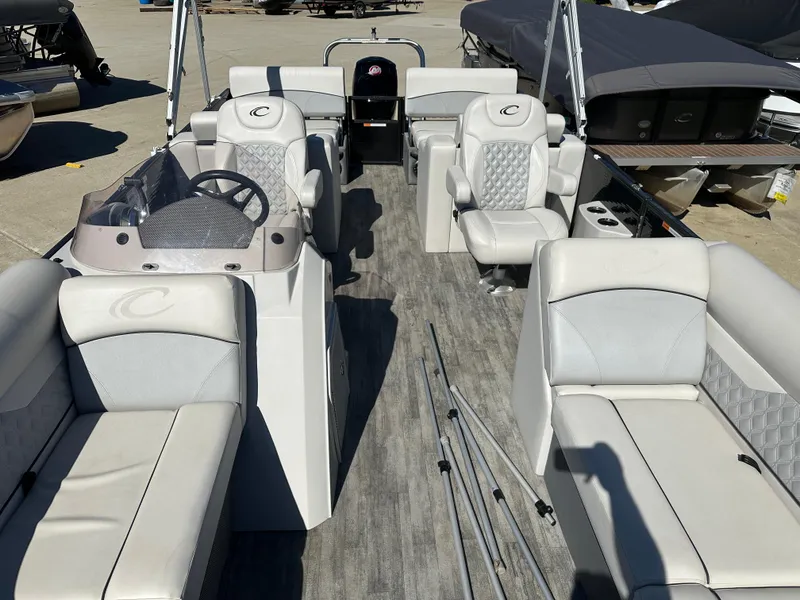 Slide: The Image of 2022 Crest Classic DLX SLRC 220 pontoon boat with spacious seating and modern design. - 3