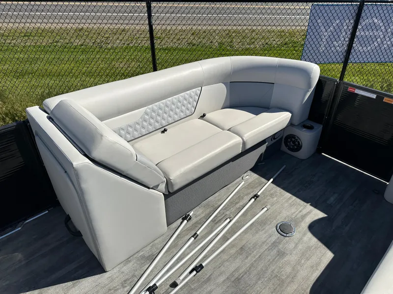Slide: The Image of 2022 Crest Classic DLX SLRC 220 boat interior with plush seating and modern design. - 7