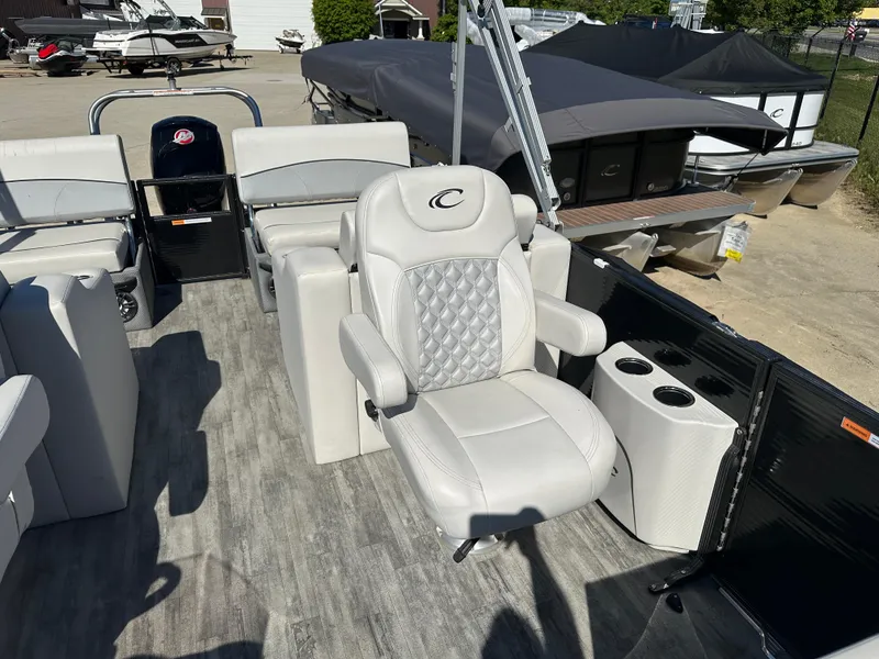 Slide: The Image of Luxurious 2022 Crest Classic DLX SLRC 220 pontoon boat interior with plush seating. - 8