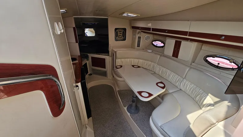 Slide: The Image of Interior of a 1997 Donzi 3250 LXC boat with seating and table. - 14