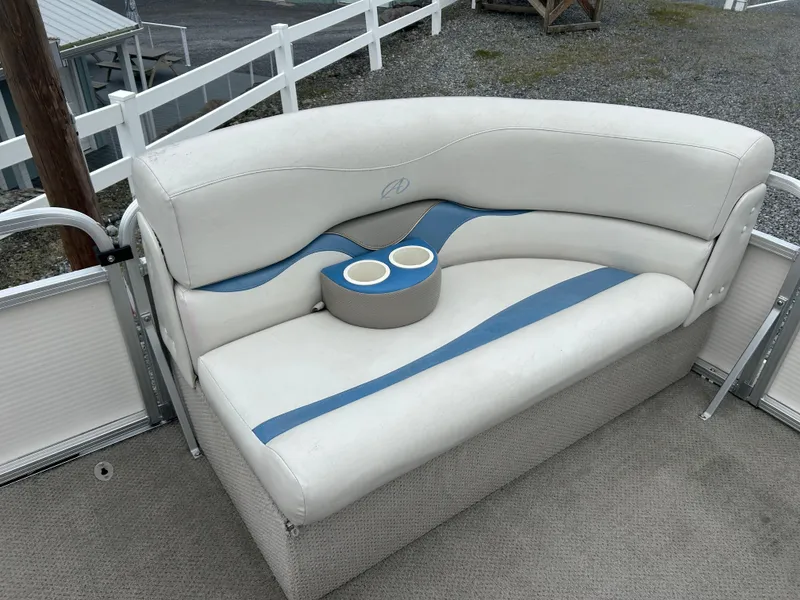 Slide: The Image of 2007 Avalon Windjammer 18' boat seat with cup holders, white and blue upholstery. - 15