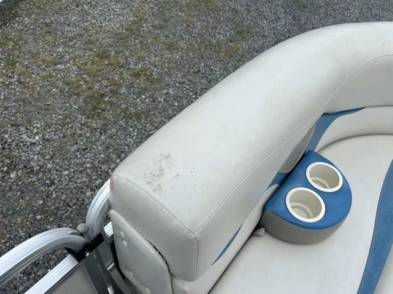 Slide: The Image of 2007 Avalon Windjammer boat seat with cup holders on gravel surface. - 17