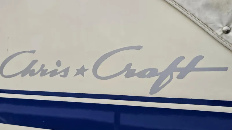 Slide: The Image of 1986 Chris-Craft 381 Catalina boat logo with blue stripe detail. - 25
