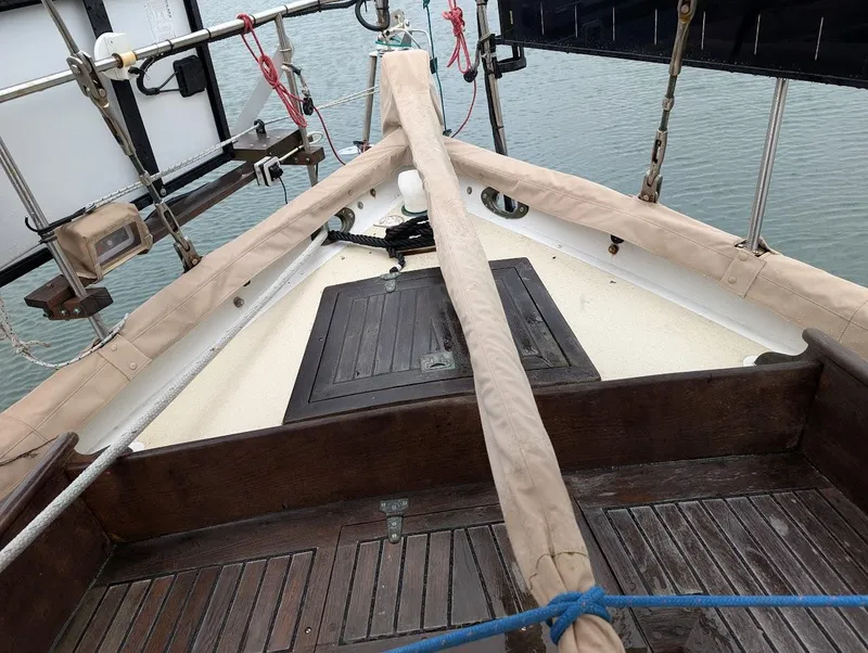 Slide: The Image of Deck view of 1977 Alajuela 38 Mk1 sailboat with wooden details and rigging. - 10