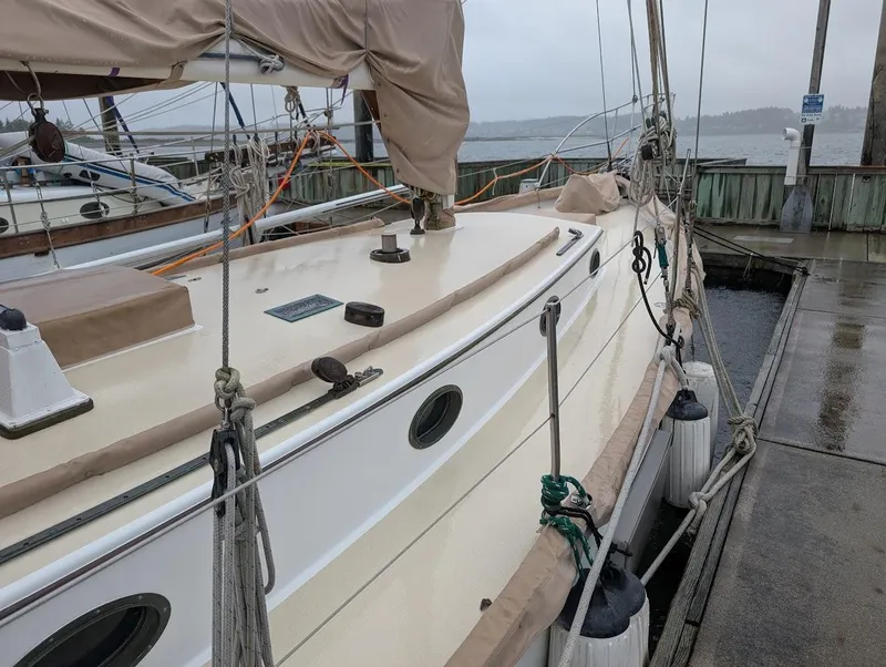 Slide: The Image of 1977 Alajuela 38 Mk1 sailboat docked on a rainy day. - 11