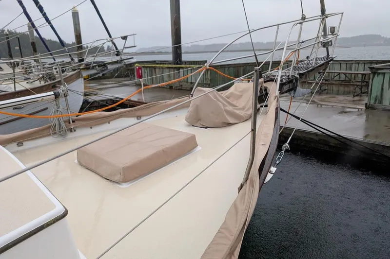 Slide: The Image of 1977 Alajuela 38 Mk1 sailboat docked on a rainy day. - 14