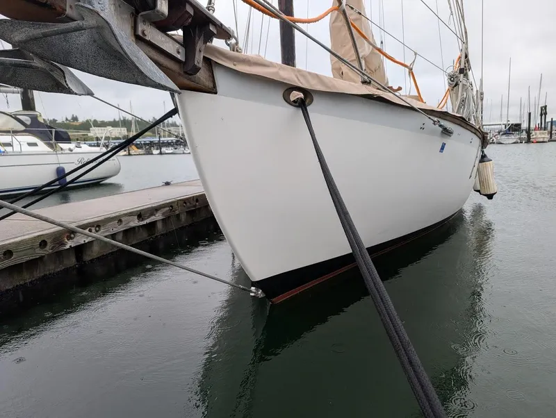 Slide: The Image of 1977 Alajuela 38 Mk1 sailboat docked in a marina, side view. - 17