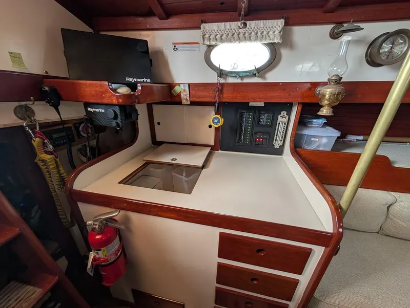 Slide: The Image of Interior of 1977 Alajuela 38 Mk1 sailboat with navigation equipment and storage. - 29
