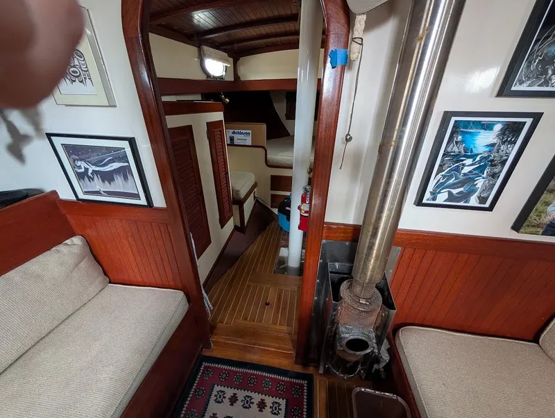 Slide: The Image of Interior of 1977 Alajuela 38 Mk1 sailboat with cozy seating and nautical decor. - 30