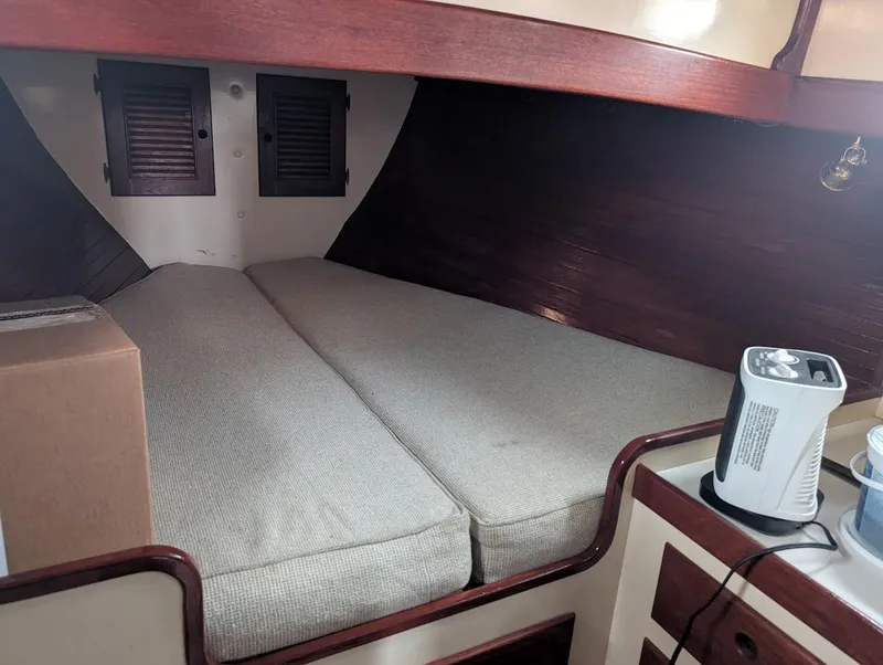 Slide: The Image of Interior cabin of 1977 Alajuela 38 Mk1 sailboat with cozy bedding and heater. - 33