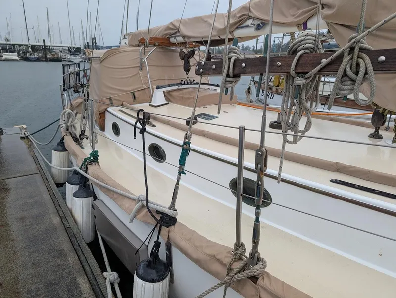 Slide: The Image of 1977 Alajuela 38 Mk1 sailboat docked at marina, featuring classic design and rigging. - 4