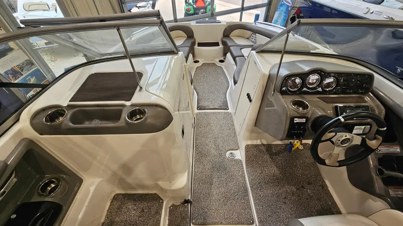 Slide: The Image of Interior view of 2011 Yamaha Boats 242 Limited S, featuring dashboard and seating area. - 13