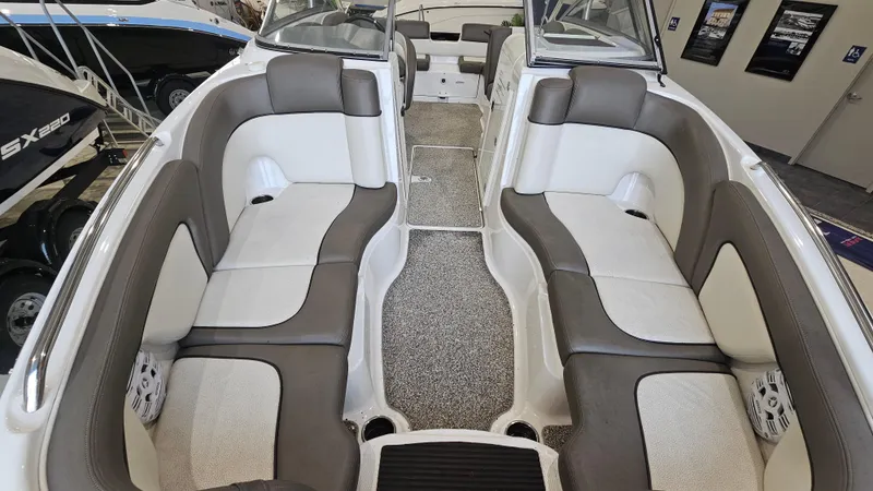 Slide: The Image of 2011 Yamaha Boats 242 Limited S interior with gray and white seating. - 15