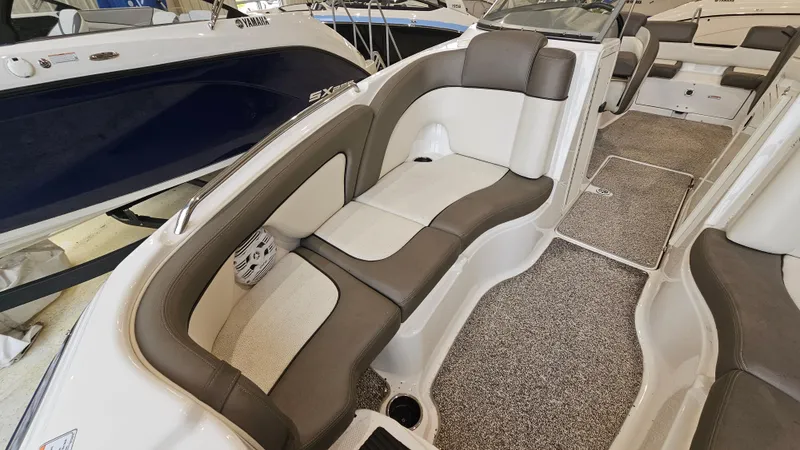 Slide: The Image of 2011 Yamaha Boats 242 Limited S interior with plush seating and carpeted flooring. - 17