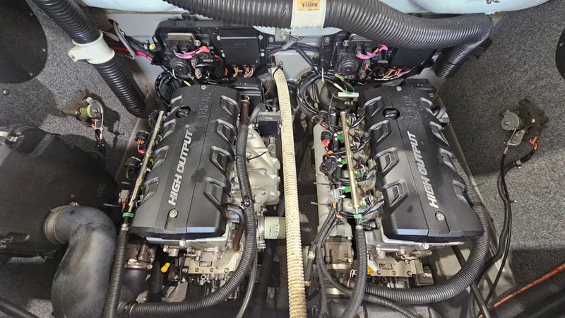 Slide: The Image of 2011 Yamaha Boats 242 Limited S engine compartment with dual high-output engines. - 21