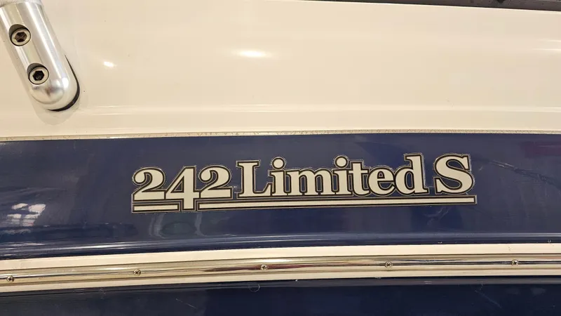 Slide: The Image of Yamaha Boats 2011 242 Limited S model nameplate on blue and white hull. - 24