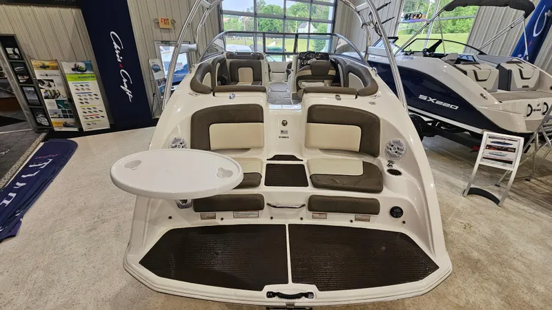 Slide: The Image of 2011 Yamaha Boats 242 Limited S with seating and swim platform in showroom. - 5