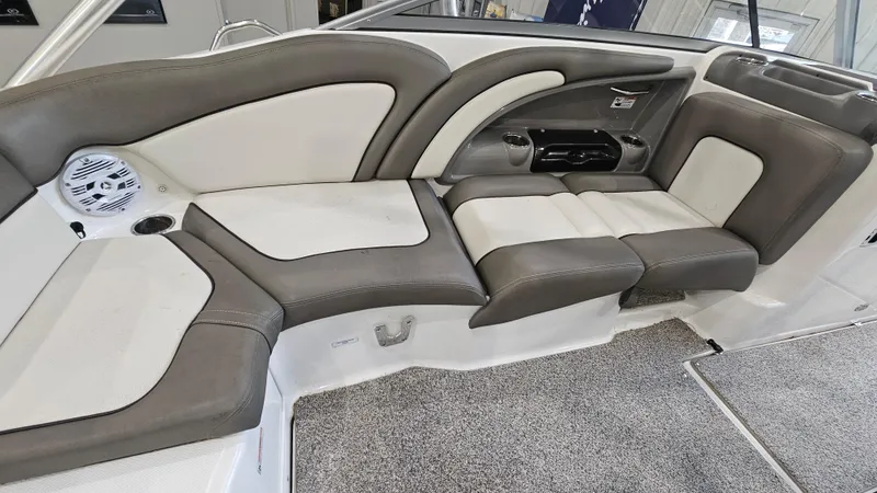 Slide: The Image of 2011 Yamaha Boats 242 Limited S interior seating with gray and white upholstery. - 8