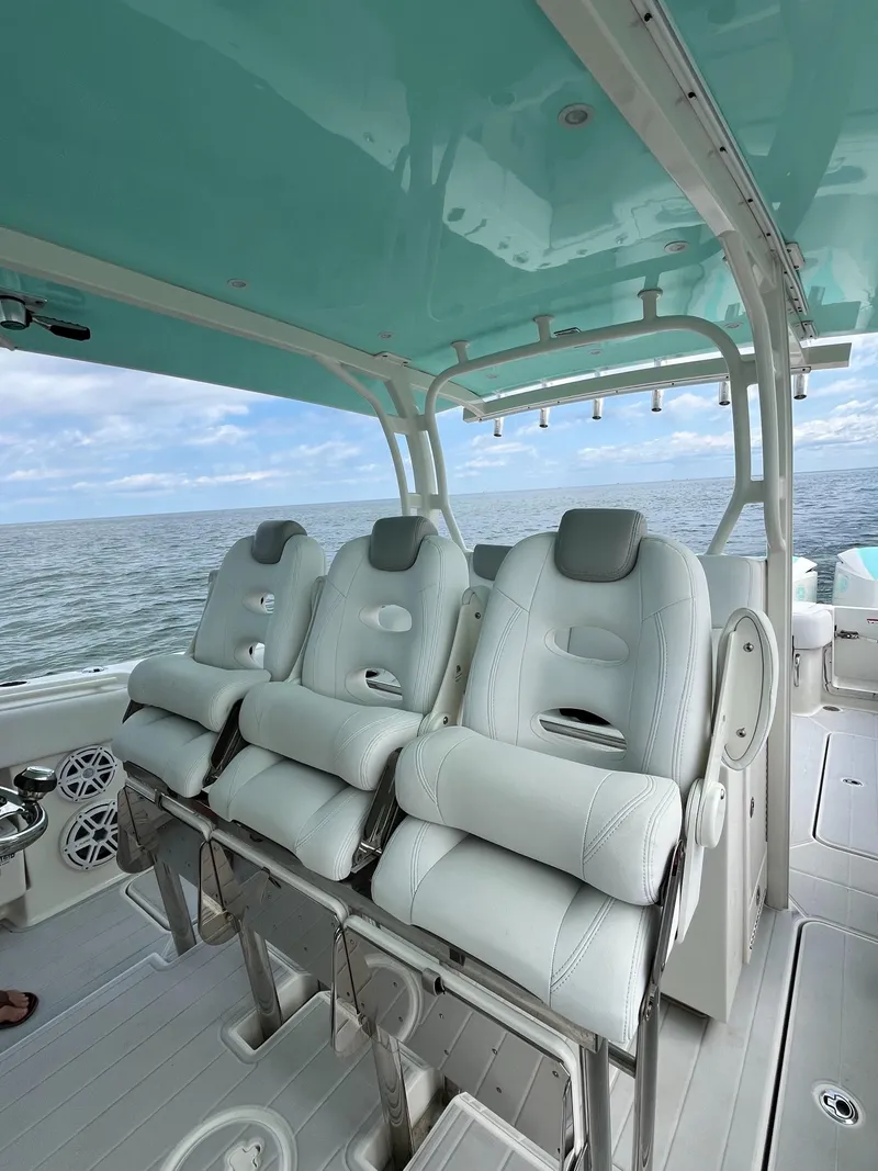 Slide: The Image of 2019 HCB Siesta boat with luxurious seating and ocean view. - 17
