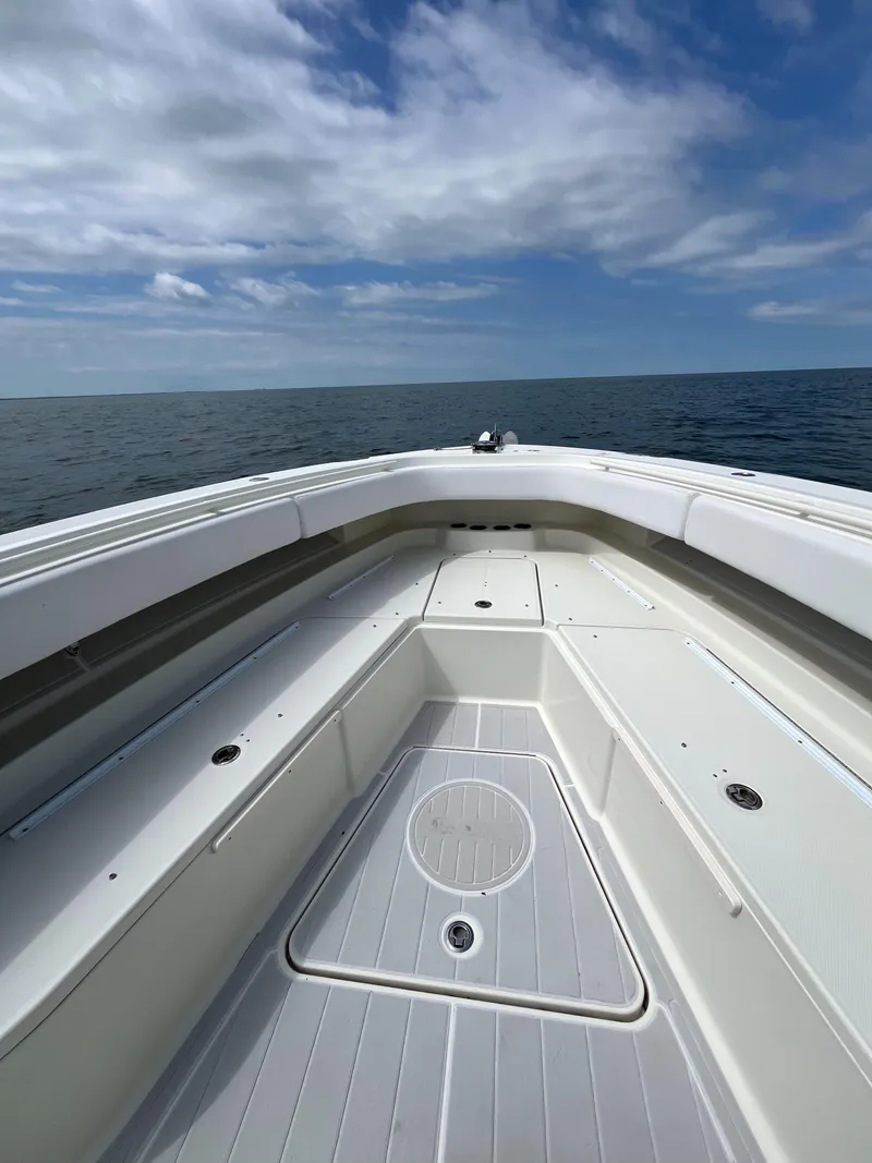 Slide: The Image of 2019 HCB Siesta boat deck with ocean view under a partly cloudy sky. - 5