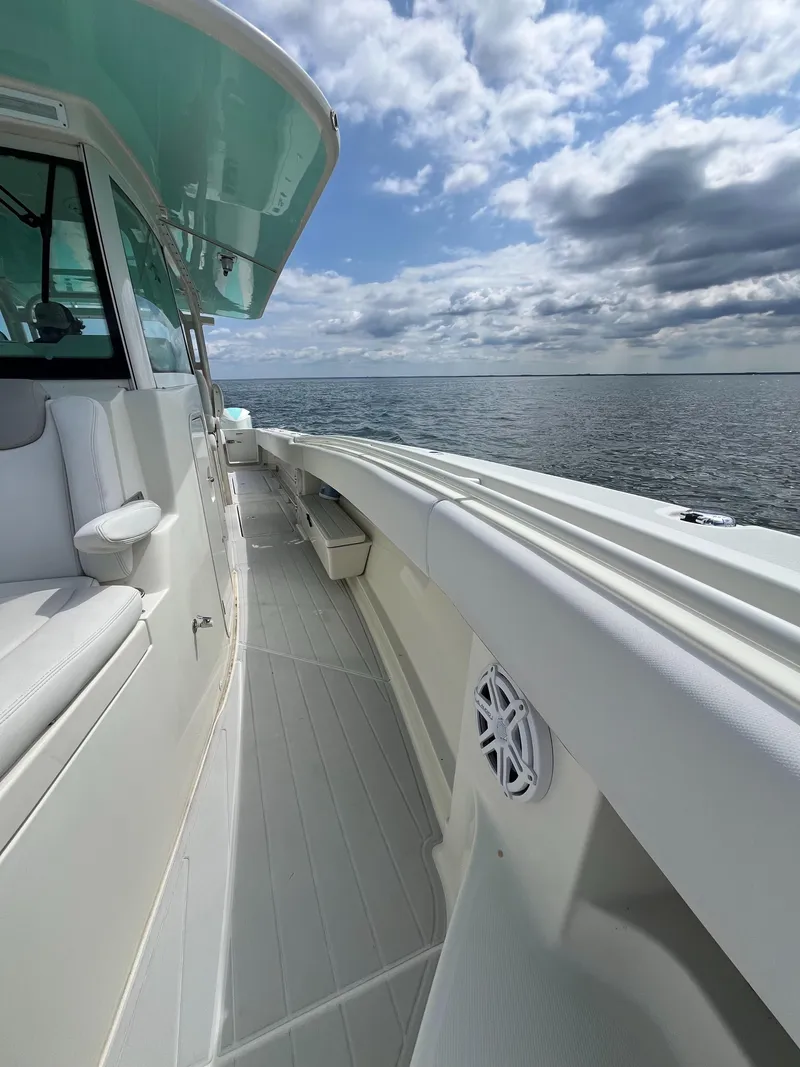 Slide: The Image of 2019 HCB Siesta boat deck with ocean view under cloudy sky. - 8
