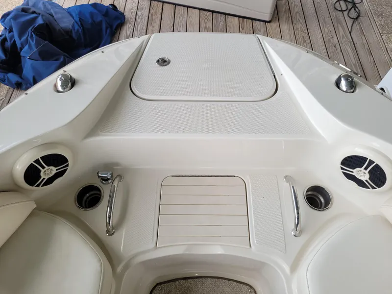 Slide: The Image of 2008 Sea Ray 260 Sundeck boat interior with speakers and storage compartment. - 11