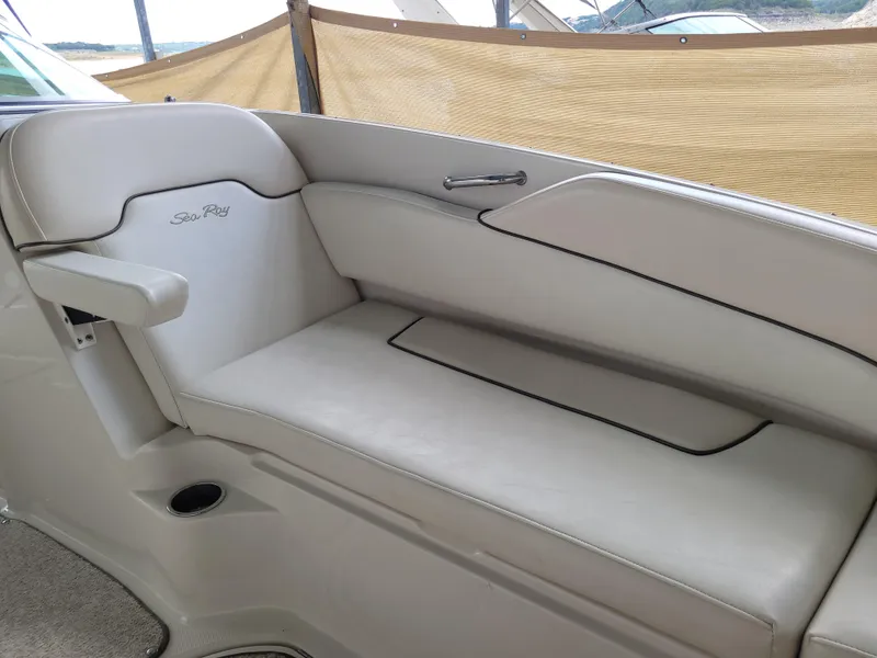 Slide: The Image of 2008 Sea Ray 260 Sundeck interior seating with beige upholstery and sleek design. - 13