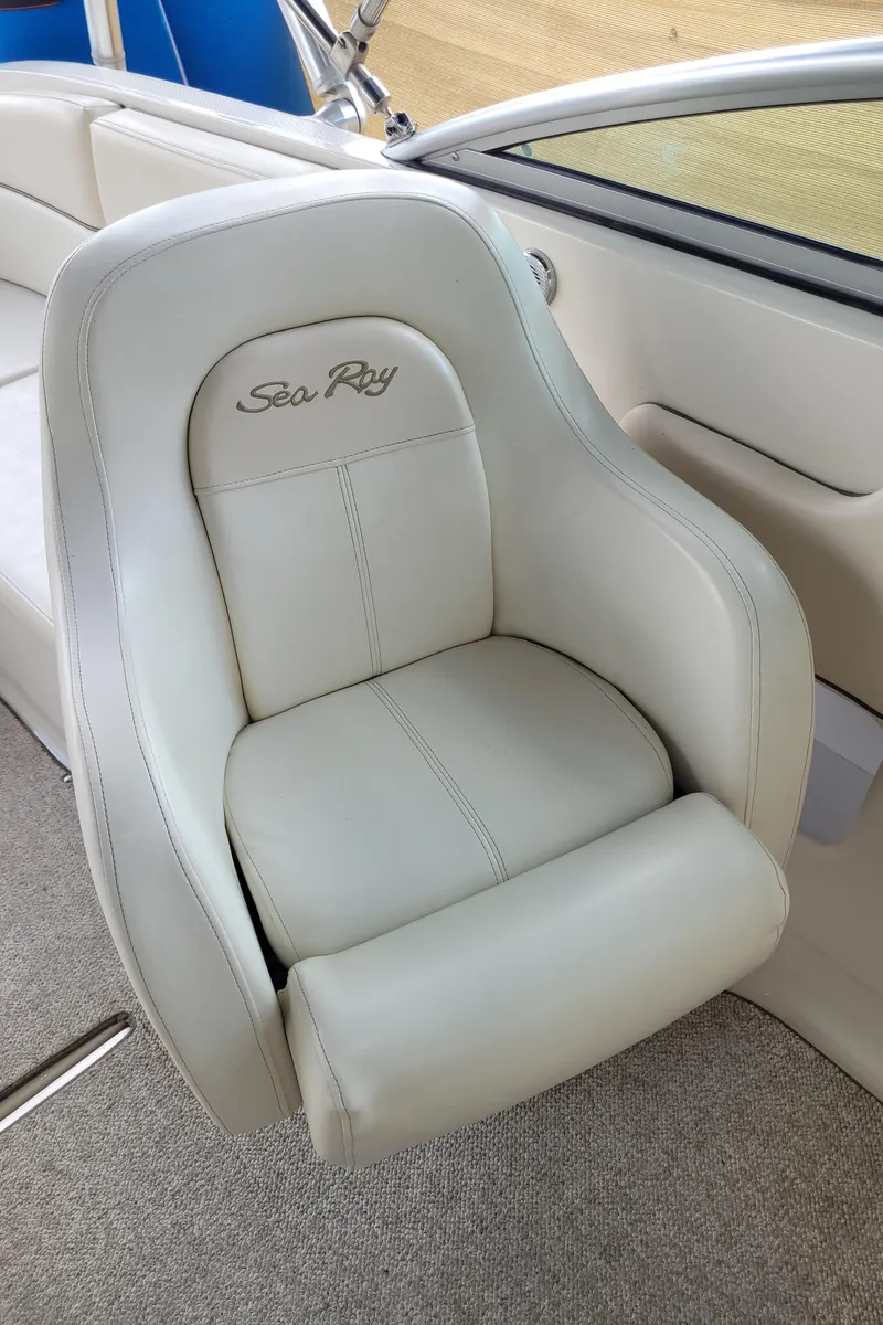 Slide: The Image of 2008 Sea Ray 260 Sundeck boat seat with white upholstery and logo. - 14