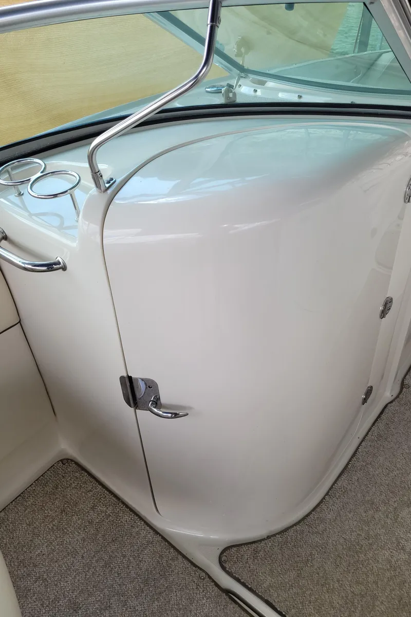 Slide: The Image of 2008 Sea Ray 260 Sundeck interior, featuring sleek design and modern amenities. - 19