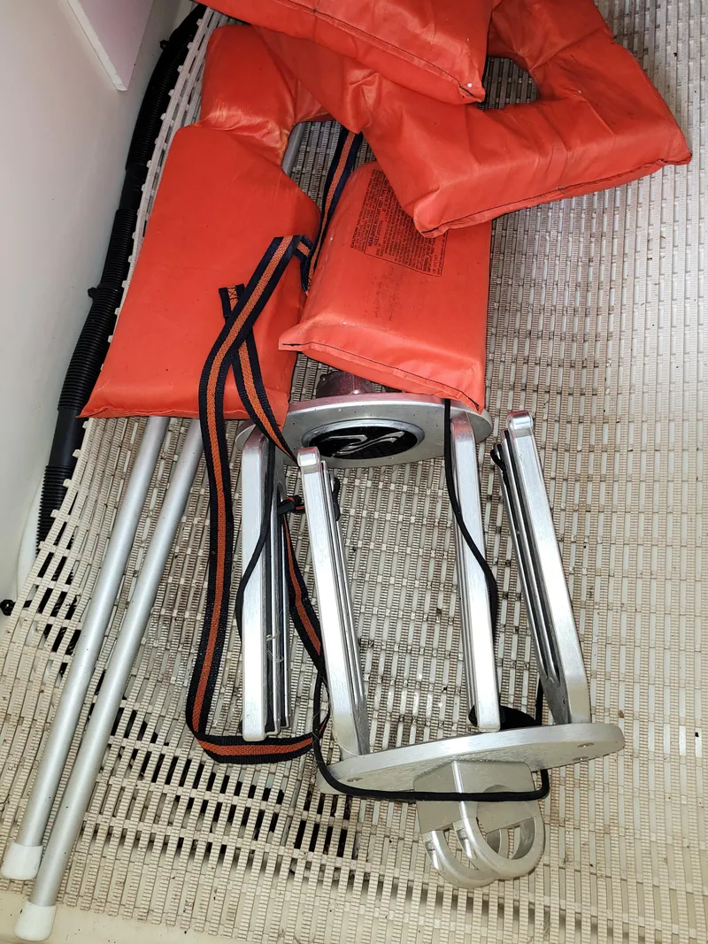 Slide: The Image of Orange life jackets and metal ladder on a 2008 Sea Ray 260 Sundeck boat. - 21