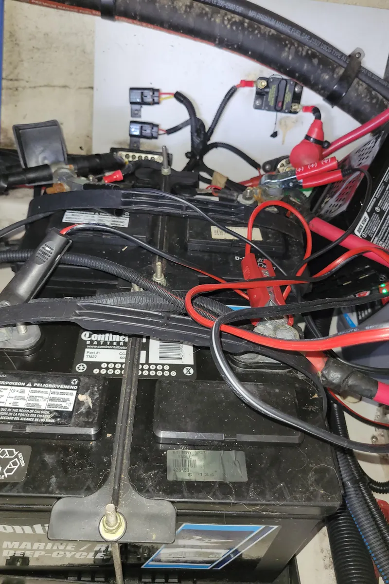 Slide: The Image of Battery compartment of a 2008 Sea Ray 260 Sundeck with cables and connections. - 26