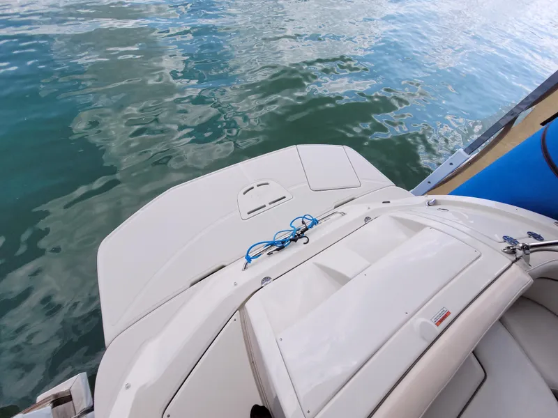 Slide: The Image of 2008 Sea Ray 260 Sundeck boat on water, rear view with swim platform. - 4