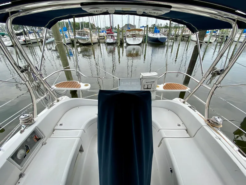 Slide: The Image of Cockpit view of 2008 Hunter 36-2 sailboat docked at marina with other boats. - 12