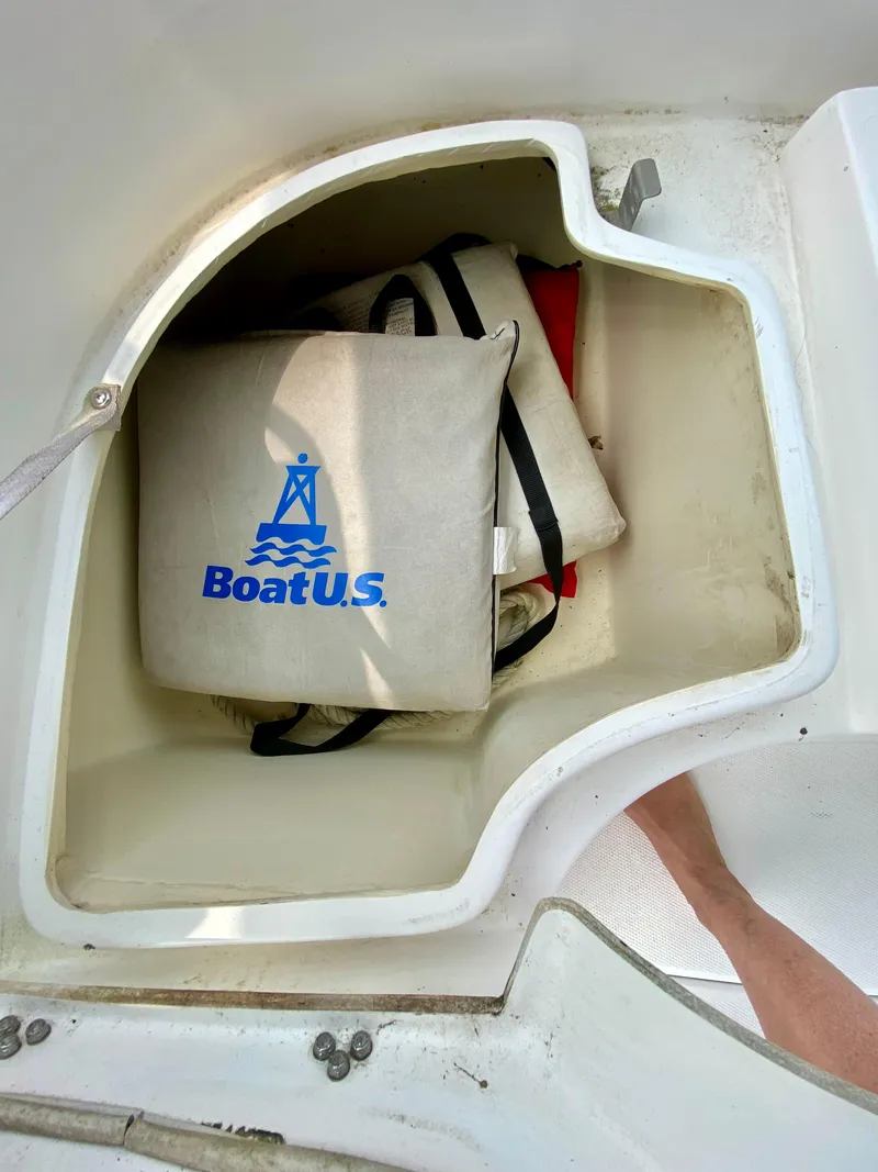 Slide: The Image of Boat storage compartment with BoatU.S. life jackets on a 2008 Hunter 36-2. - 14