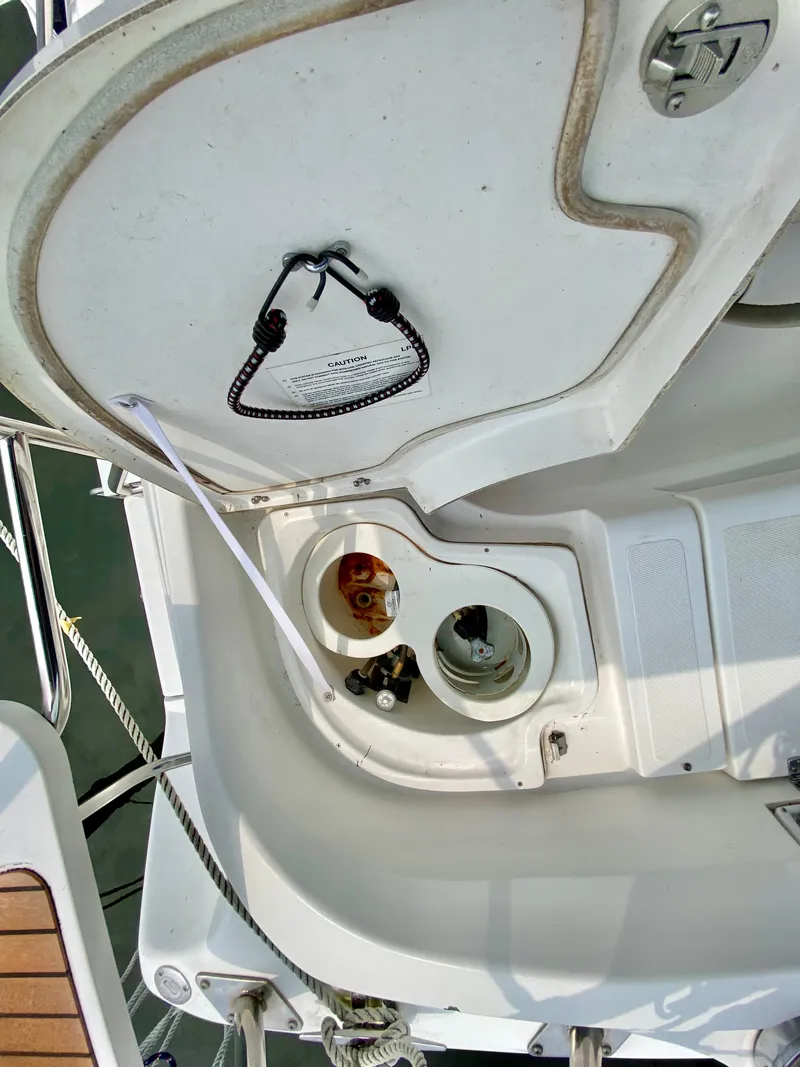 Slide: The Image of 2008 Hunter 36-2 yacht deck with open hatch and visible fittings. - 16