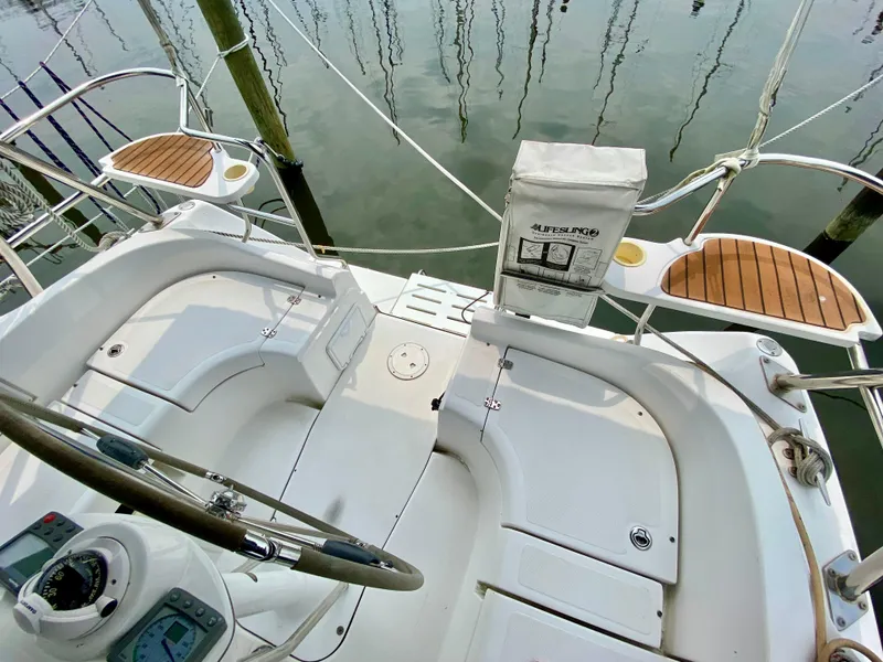 Slide: The Image of Cockpit of 2008 Hunter 36-2 sailboat with wooden accents and steering wheel. - 18