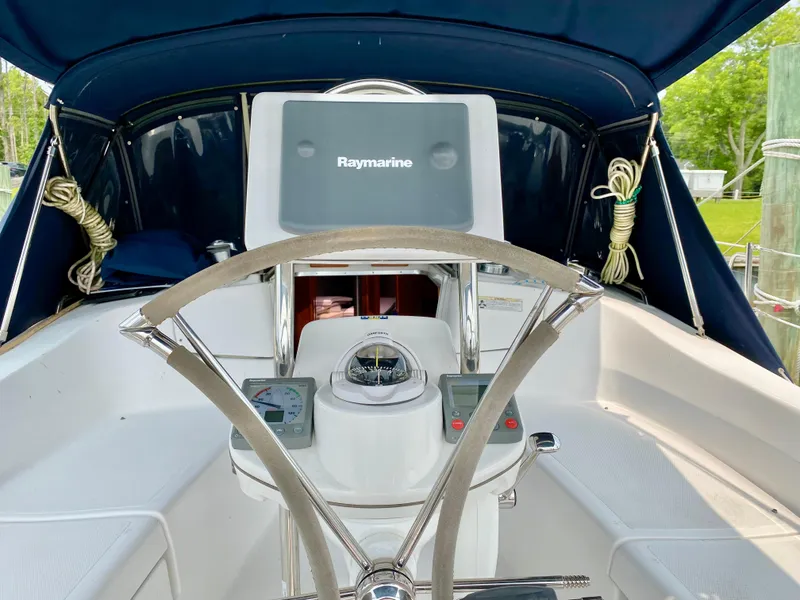 Slide: The Image of Cockpit of 2008 Hunter 36-2 sailboat with Raymarine navigation system and steering wheel. - 21