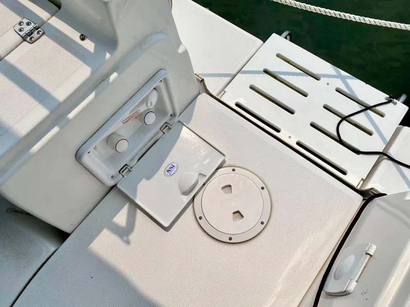 Slide: The Image of Deck of 2008 Hunter 36-2 sailboat with storage compartments and seating area. - 26