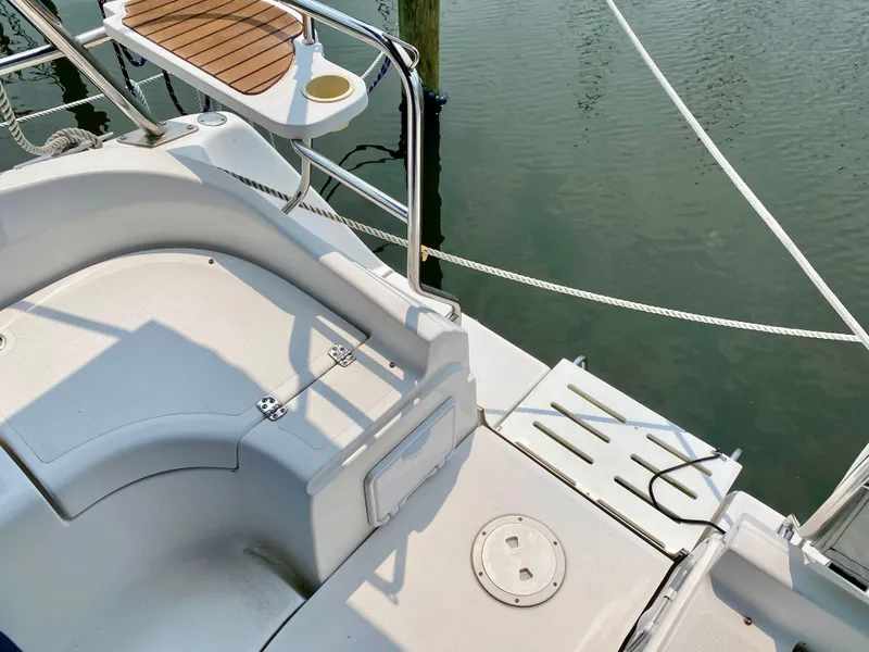 Slide: The Image of Cockpit of 2008 Hunter 36-2 sailboat with seating and table, docked at marina. - 27