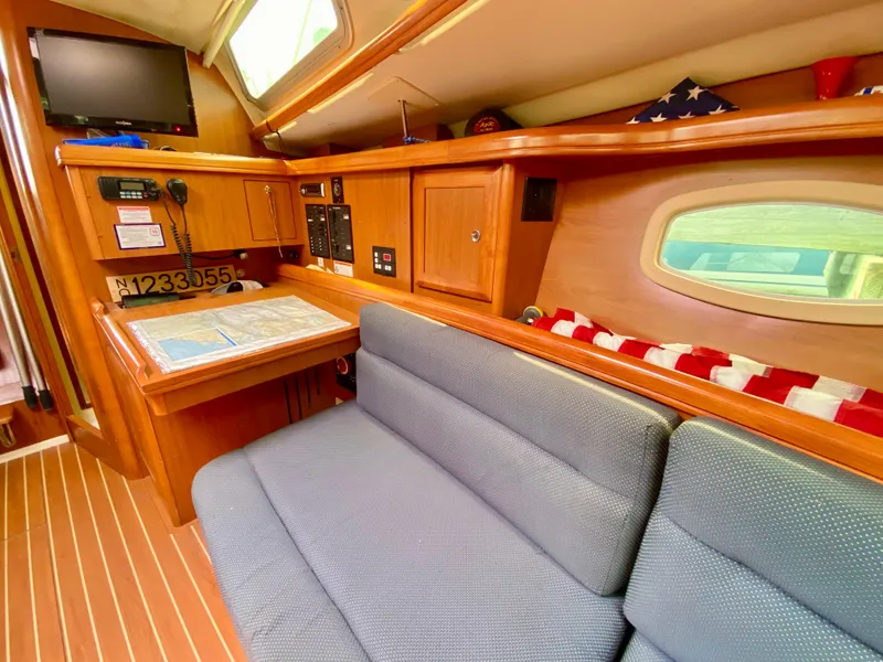 Slide: The Image of Interior of 2008 Hunter 36-2 sailboat with cozy seating and navigation area. - 37