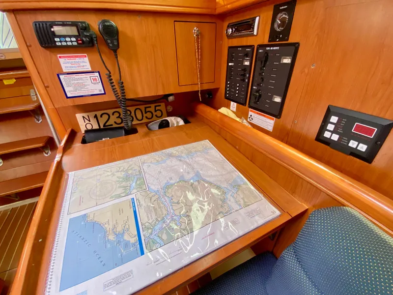 Slide: The Image of Navigation station of 2008 Hunter 36-2 sailboat with map, radio, and control panels. - 41