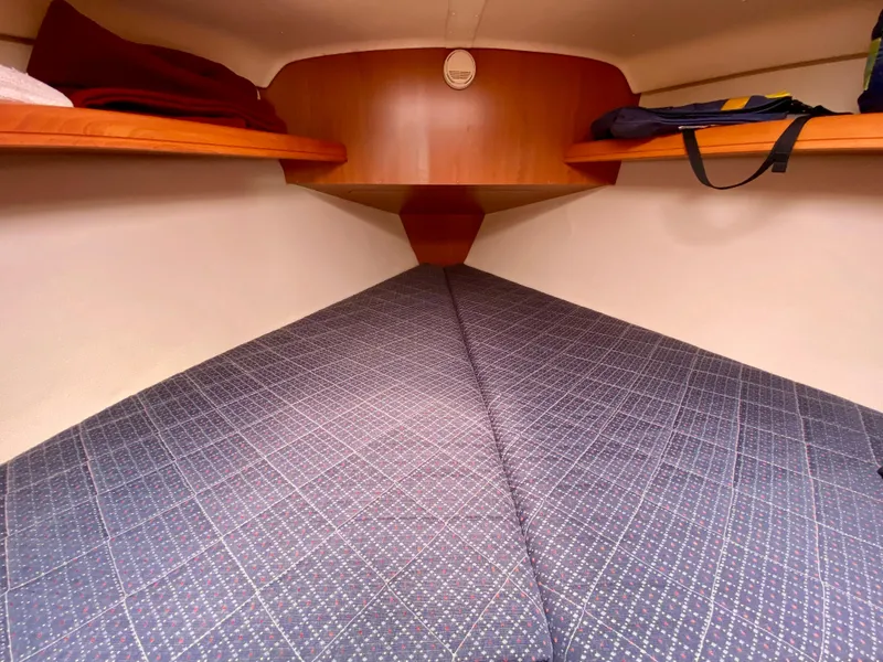 Slide: The Image of Cozy cabin interior of 2008 Hunter 36-2 sailboat with patterned bedding. - 44