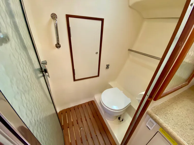 Slide: The Image of 2008 Hunter 36-2 yacht bathroom with shower, toilet, and wooden floor. - 48