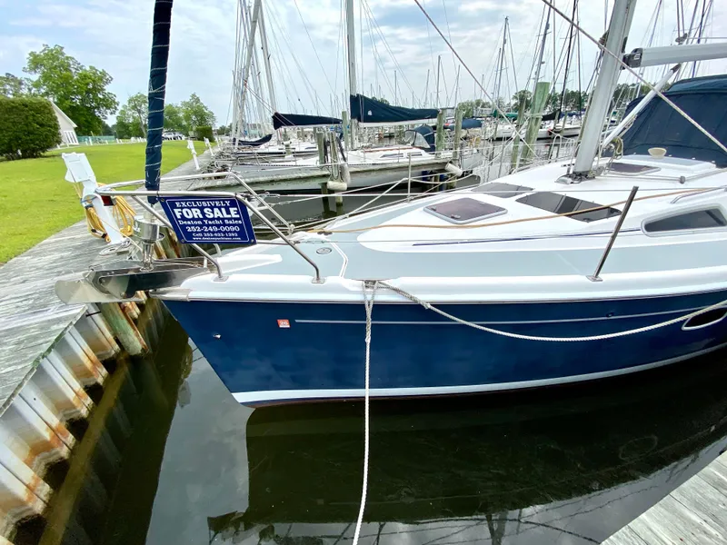 Slide: The Image of 2008 Hunter 36-2 sailboat for sale, docked at marina with "For Sale" sign. - 6