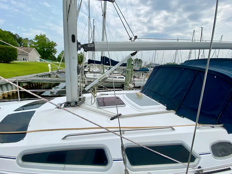 Slide: The Image of Sailboat Hunter 36-2, 2008 model, docked at marina with overcast sky. - 8