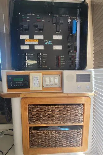 Slide: The Image of Control panel of a 1995 Sea Ray 440 Express Bridge yacht with storage baskets. - 23