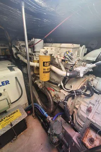 Slide: The Image of Engine room of 1995 Sea Ray 440 Express Bridge with Caterpillar components. - 26