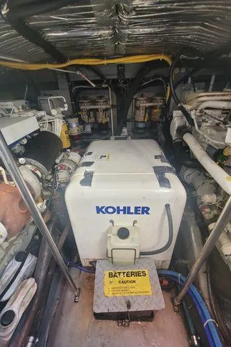 Slide: The Image of Engine room of 1995 Sea Ray 440 Express Bridge with Kohler generator. - 28